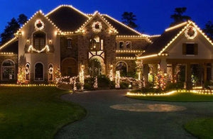 Large house decorated with Christmas lights at night