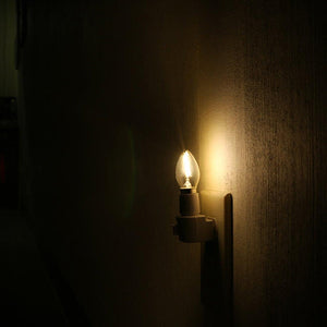 warm white filament lit in dark area